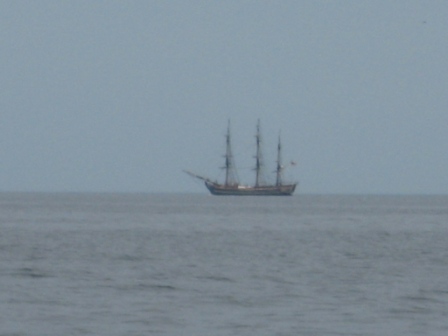 11.) tall ship on horizon