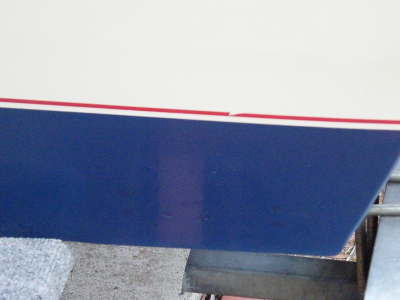 11 transom screws or former screws sealed with adhesive sealant were removed, properly filled, and a gelcoat patch kit applied.  Color matching of the kit was definitely off.
