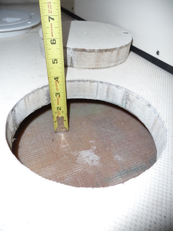 2. Cockpit Floor Access showing a grey foam core. This void space under the cockpit floor had collected several gallons of water in the first 6 weeks in the water, due to a faulty instalation of the salt water wash down pump pick up.