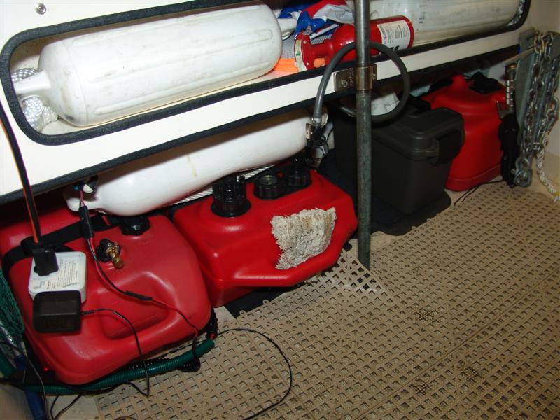 21 gallons of fuel with quick disconnects, toolbox, 4 dock bumpers, 2 sponges, 2nd fire extinguisher, inflatable ball, 2 collapsable paddles, 1 small wood paddle, 2nd anchor, utility knife, hand bilge pump and electric bilge pump in there.