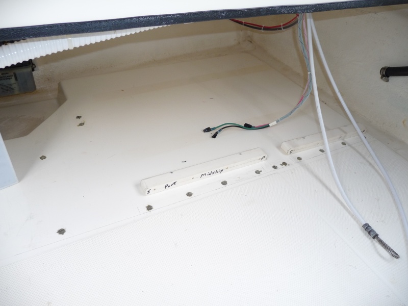 3. Port side of cockpit, ahead of the fuel tank. The holes have now been filled with "System Three" Cold Cure epoxy. I used a syringe to fill the bottom of the hole first, and work the air to the top and out.