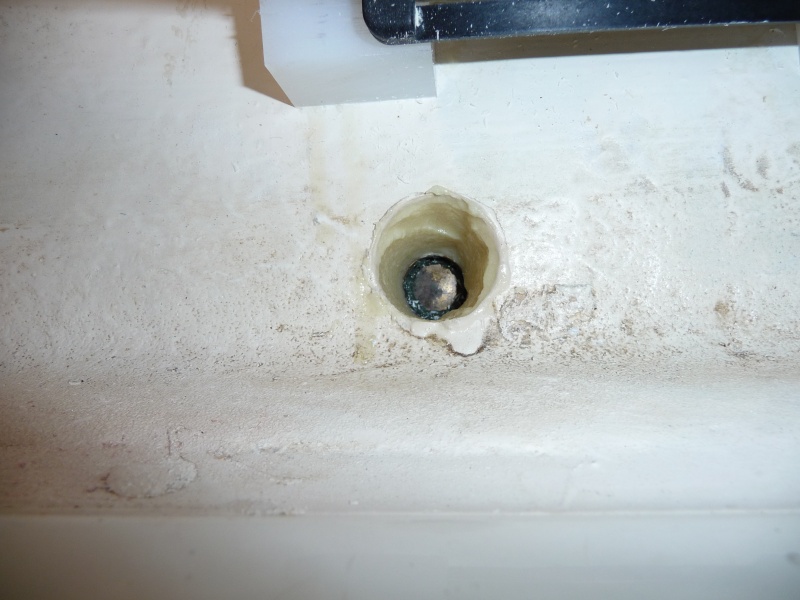 5. Inside of drain plug hole filled in with epoxy. Drain plug in place.