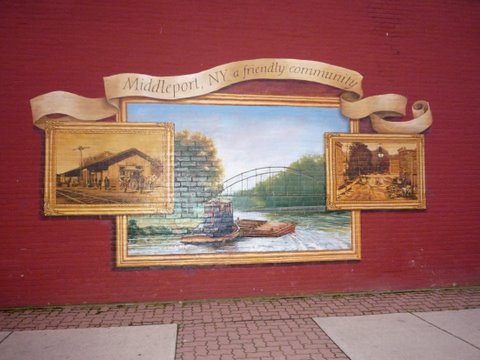 A mural on a store wall Middleport was nice home of the Basket Factory rest. Yum.Has close by laundrymat, good breakfast joint, gas not too far away. Canal facilities right next Police station very safe place. Shore power, water nice picnic benches on grassy area. Liked it here. Showers were so so.