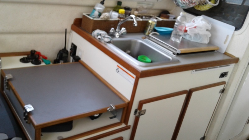 Additional counter space under helm seat