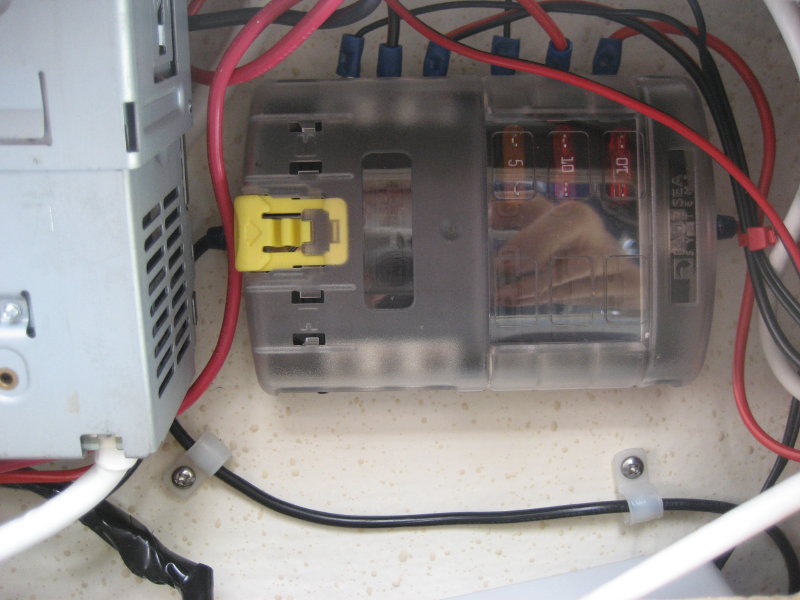 Additional fuse panel installed above overhead shelf providing room for additional electronics and requiring  only one set of  power leads running up to shelf from main fuse panel.