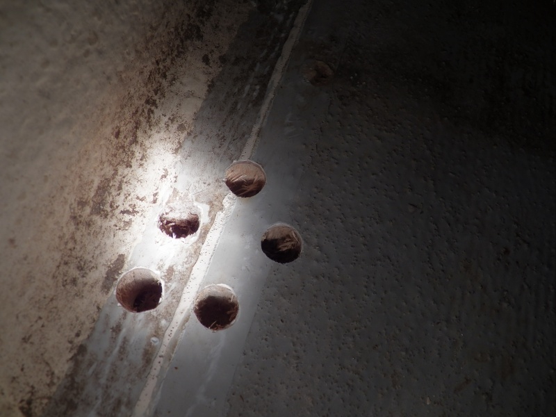 Additional holes needed to be drilled, radiating out from the rotten hole to determine the extent of the damage.  I could have drilled smaller holes, but I wanted a really good look to make sure that the rot had not spread.  The balsa surrounding the center hole was soggy, but not yet rotten.