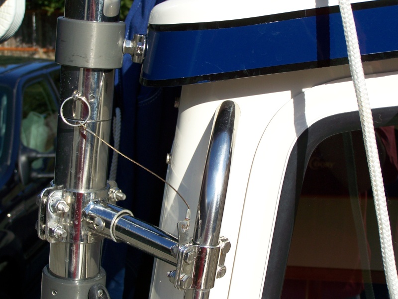 Additional support clamped to grab handle. Pin allows arm to be locked in set position when needed. With pin removed arm rotates as neccessary when loading/unloading dinghy.