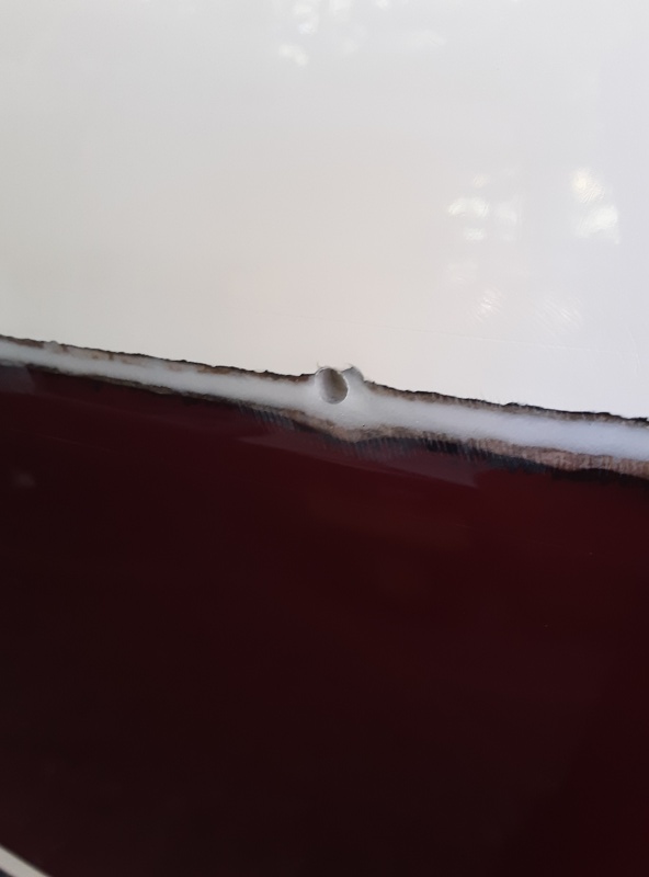 after filling the crack and all the holes with thickened epoxy I put the rail back up and redrilled only the holes that I was putting a bolt thru