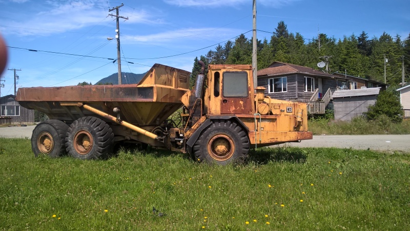 An articulated dump truck of unknown vintage and still operational.