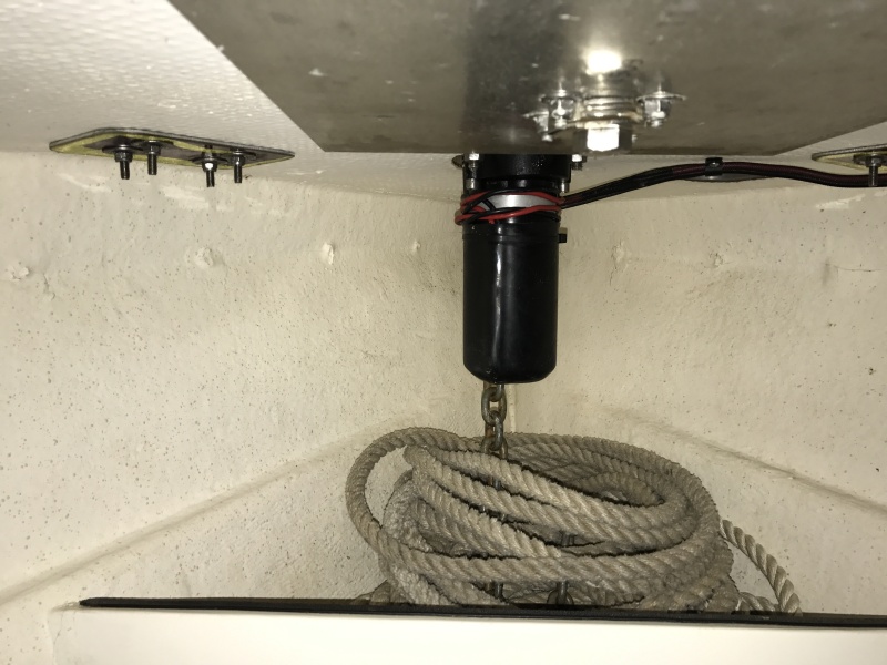 Anchor locker with vertical windlass.