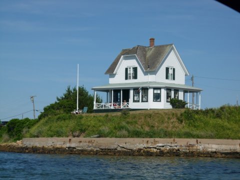 Anchored in Block Island in shallow water for the fire works which go off just of the right of the house.