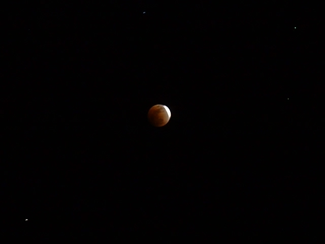 Another eclipse pic, taken with our old Fuji. That is Saturn on the lower left.