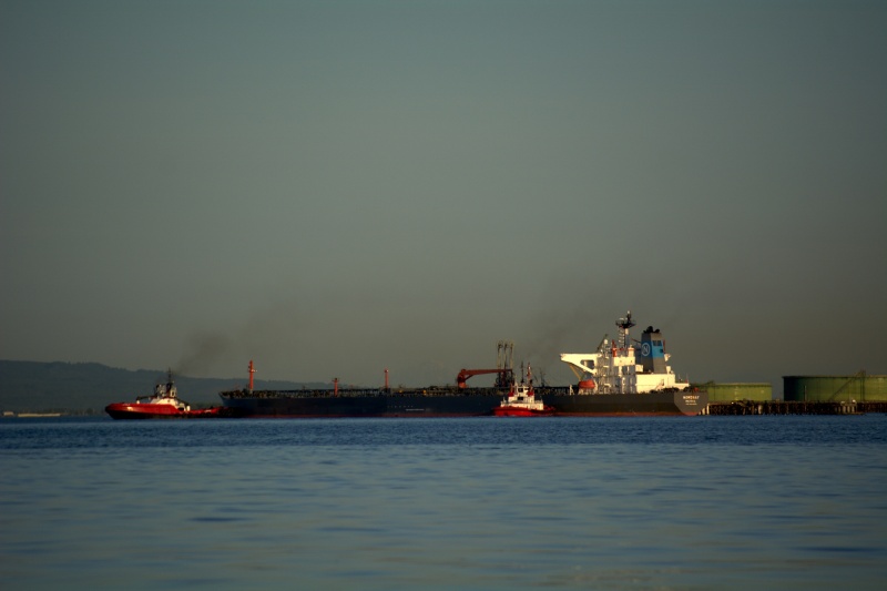 Another tanker being docked at the refinery