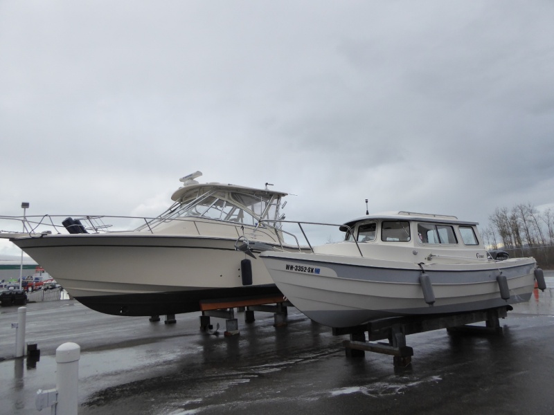 Back at the marina washing down. 33' Grady on next stand.