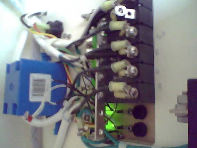 Back of AC power panel.  After 8 hours on shore power with no problems I noticed sparks then no AC juice.  Upon close inspection, the wire between the reverse polarity switch and the main bus board was cooked.