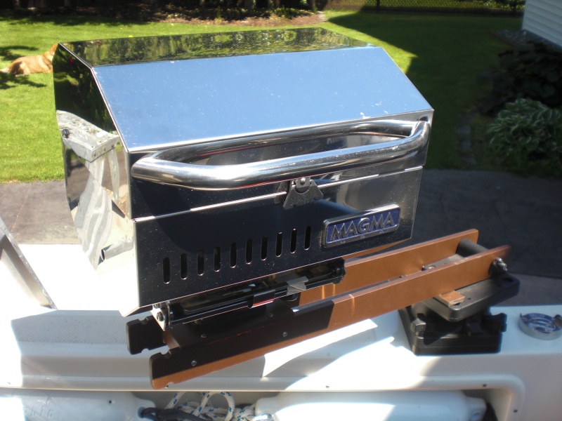 BBQ mounted inboard.  Underneath the BBQ there is a Scotty male part that slots into the Scotty female part.