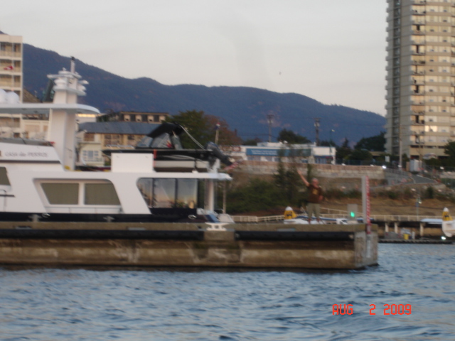 Bill 'HALCYON' at end of dock waving goodbye