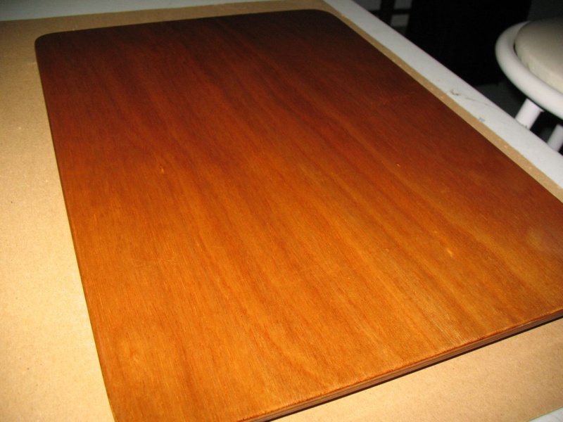 Board made utilizing some scraps to fill the hole from the Wallas (removed and sold).  Just some scrap 1/8" ply epoxied together to make 1/4", then cut out, some cleats stuck to the bottom side, and then varnished.