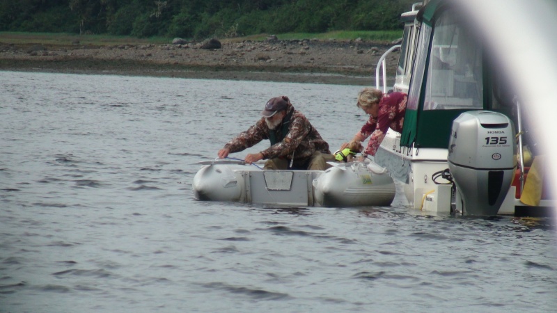 Brent taking Rusty to shore-Portage Bay