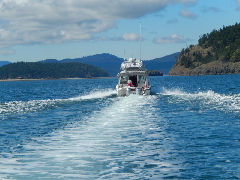 C-Cakes, with Patti out in back, ahead of See-Saw motoring through the San Juans