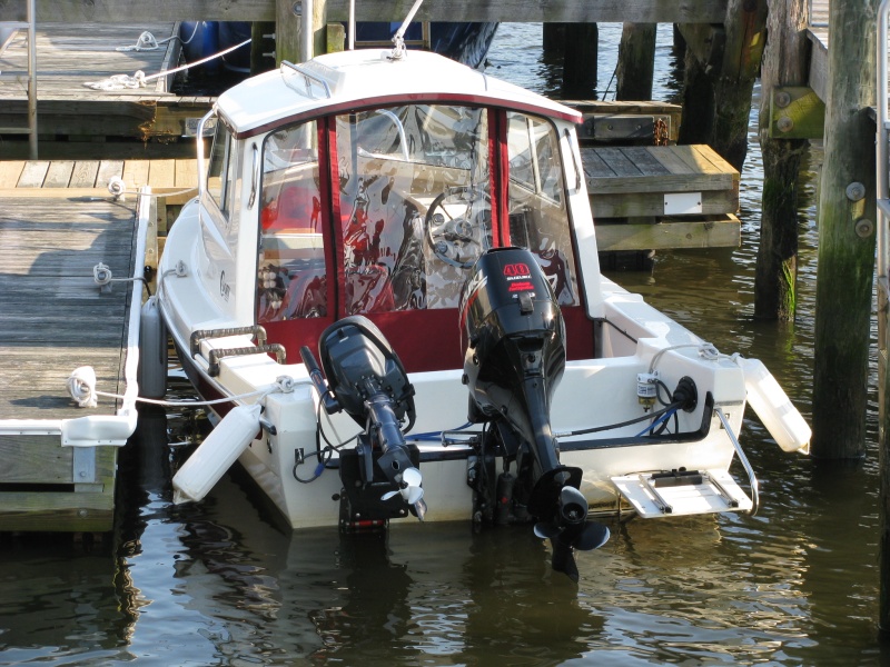 C-Dory 16 Cruiser with Suzuki 40HP 4-Stroke and Yamaha 4HP 4-Stroke Kicker -- Stern view showing security cable placement for kicker