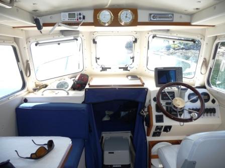 Cabin Interior fully lined with marine foam insulation and covered with marine vinyl.
All Storage lockers on board are also lined with 1/2" sheet foam insulation. 
I have no condensation collecting on the cabin liner or in the storage lockers. No need for fans on the forward windows.
The sheet foam in the storage lockers also gives cushion to all stowed articles and the boat is very quiet while running.