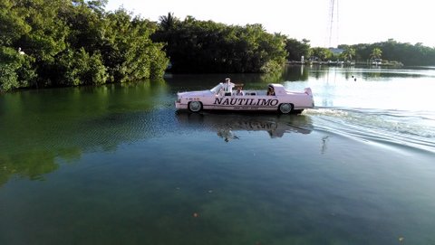 Cadillac convertible made into a boat. A newly married couple enjoying a sunset cruise. You gotta love the Florida Keys
