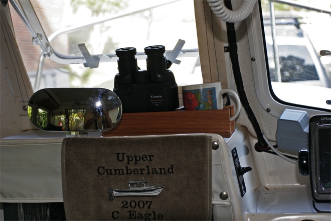 Center console covered with grippy mat.  A prized addtion is the embroidered towel given to us by Brenda Byrd at our first CD gathering. Binoc / cup holder will be mounted in front of helm. Windlass switch can be reached from helm, standing at center window or from the foredeck.