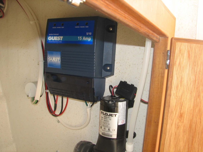 Charger on stern wall in galley cabinet