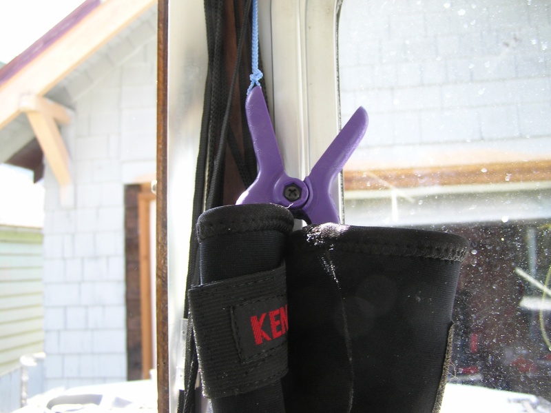 Cheap little spring clips from Home Depot  hold gloves / hats etc