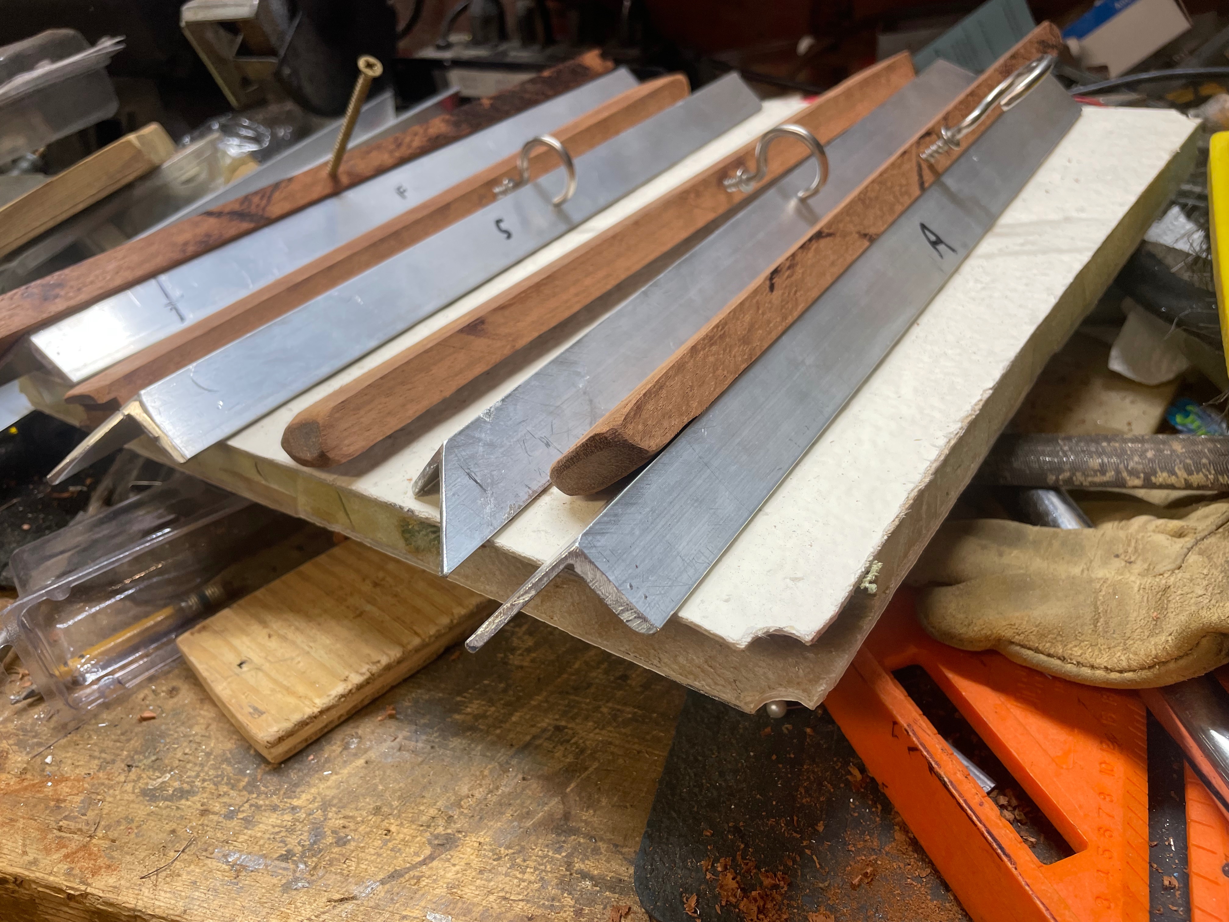 Cherry inserts with 1/8” aluminum angle trim