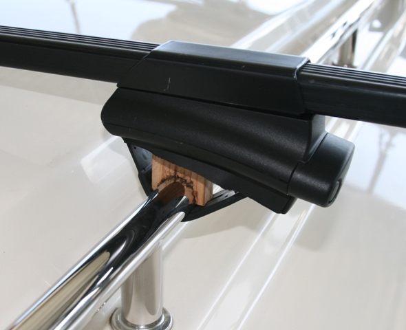 Close up of Thule CrossRoad tower with wood spacer for clearance of cabin roof