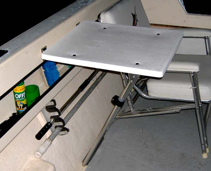 Cockpit table made from a jump seat frame.