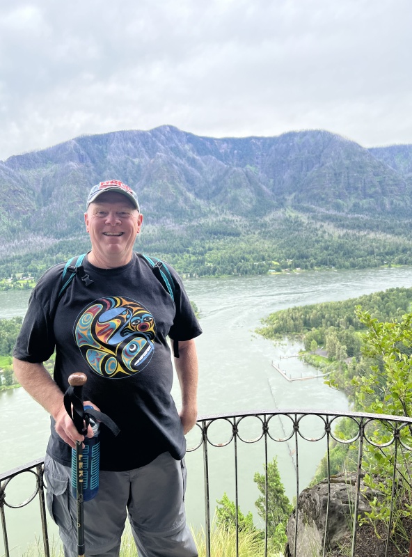 Colby on Beacon Rock with the docks in the background