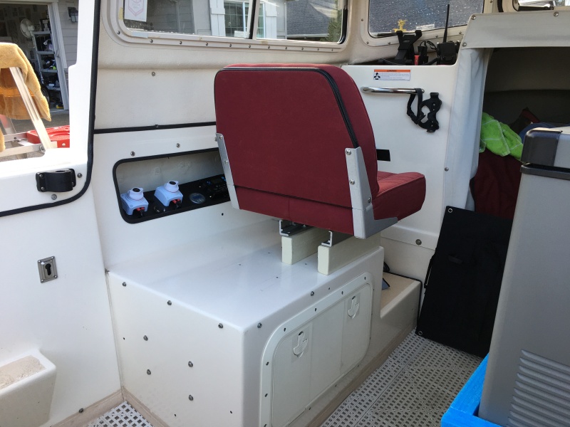 Control panel near the port seat.  The house battery and charger are below the seat.