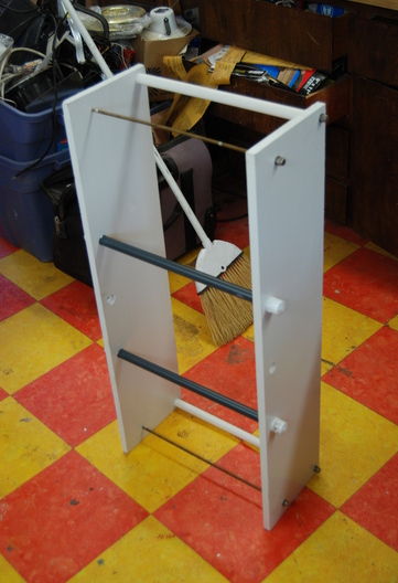 Cooler holder for rack.
Used 2 36" x 1/4 brass threaded rodsfrom H.D. (each cut in half to make 4. Used 1/4 SS cap nuts on front 1/4 ss nylock nuts on back.
Used 1/2" sced. 40 PVC as top seperator.
Drilled a couple 7/8" holes in the bottom and used 18"x1/2 threaded PVC risers with twist on caps (spaced and located so they can be placed through any 2 rungs on the ladder/rack, so that cooler can be placed anywhere on rack to maximize boat balance and or rear view. I used 7/8" wood (just because I had it) 1/2" starboard would likely be more durable but this will last a long time. May need to notch for the spring latch so that it can fit far left.
