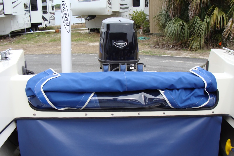 cover rolled and stored still attached
to back of lazerette
