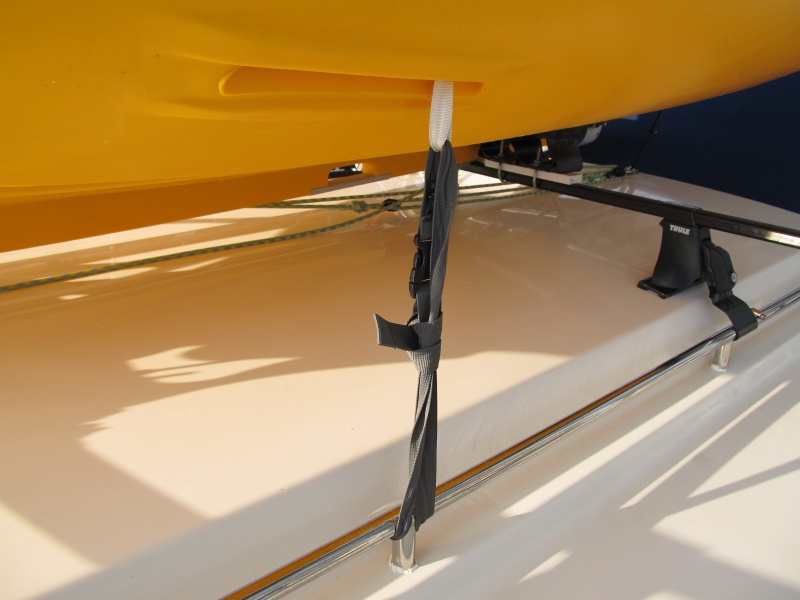 daggerboard webbing tiedown on each side line up well with the roof rails (it is just loop of webbing and the knot at the top keeps it from being pulled down through)