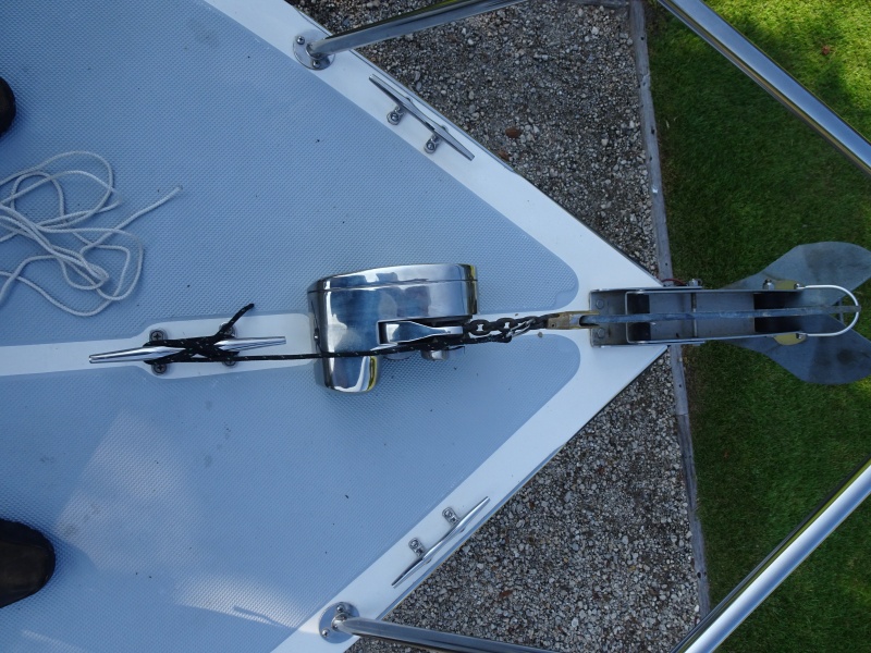 Delta anchor, windlass and preventer.  also note extra cleat on each side for anchor bridle, with rub strips better than chocks on C dory.