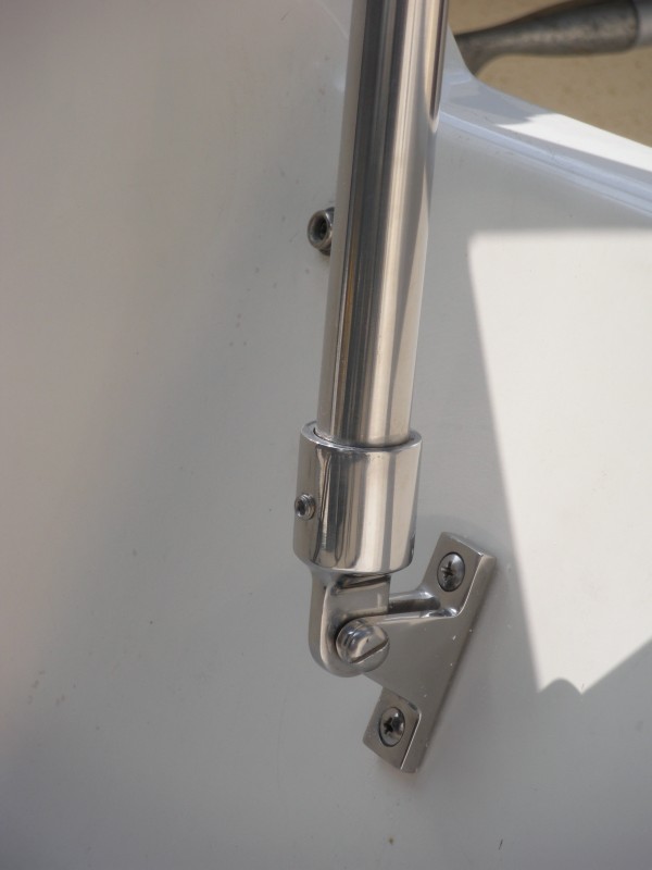 Detail shot from the other side.  Note: buy the hardware (14" SS bar, base and bar end) from your local canvas shop.  Shepherd Canvas charged me $18 for this gear; West Marine would have been closer to $75!
