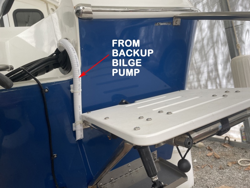 didn\'t want to combine with primary pump or make new thru hull so I ran the hose through to transom via the engine control boot