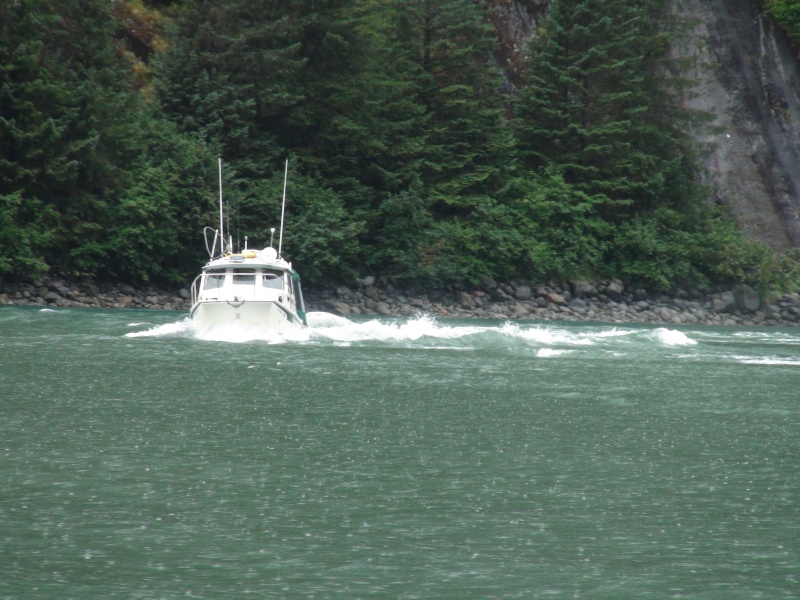 Discovery runing up the incoming flood tide at the entrance bar to Fords Terror inlet