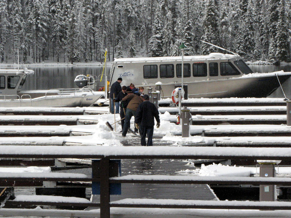 Dock hands cleaning of the docks on the way to the Lake Queen