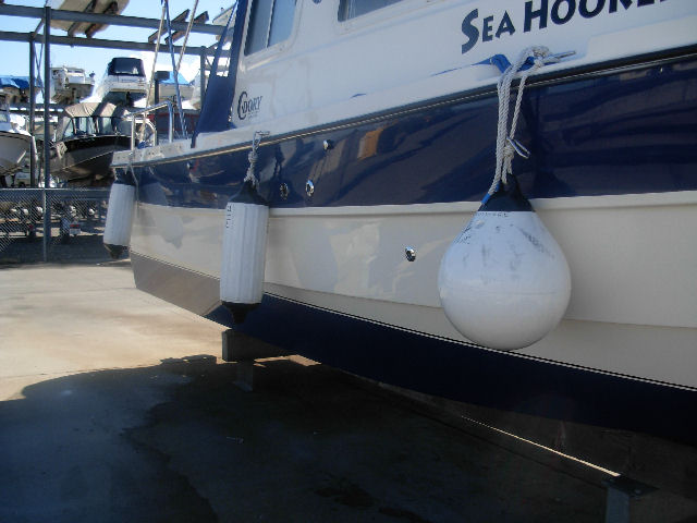 "Docked" fender configuration.  Mid fender clipped to bow eye through cockpit.