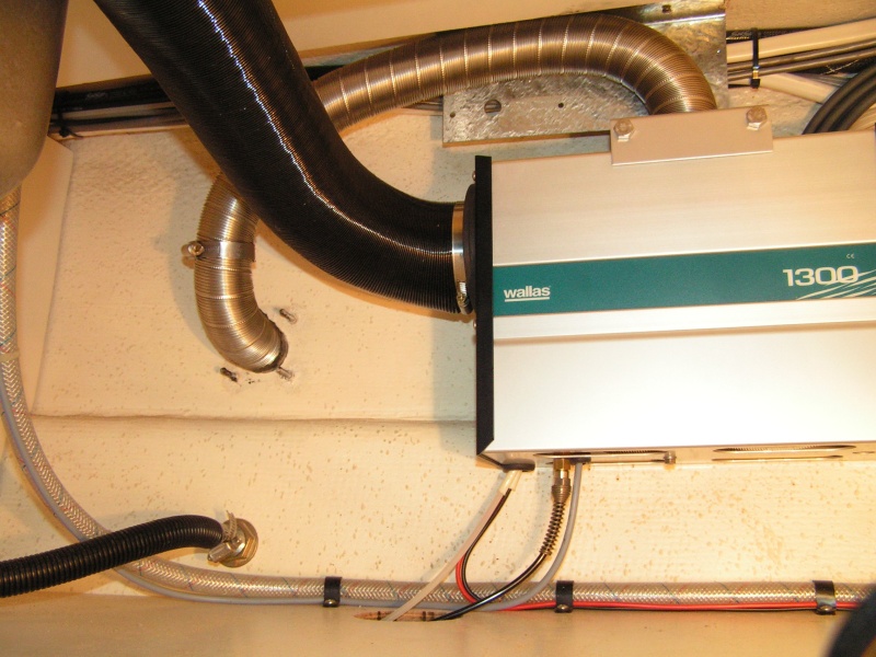 (Dora~Jean) Intake/exhaust hose and inside cabin hot air duct. Note fabbed insulating plate for intake/exhaust hose, it is spaced 1/4" on top from fiberglass.