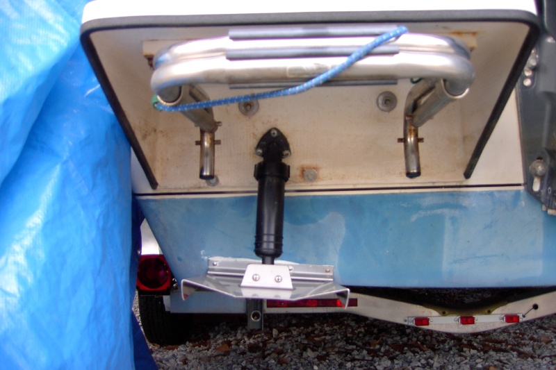 Drilled thru both swim step and the boat for the hydro line. No real need to remove and notch out the swim step.