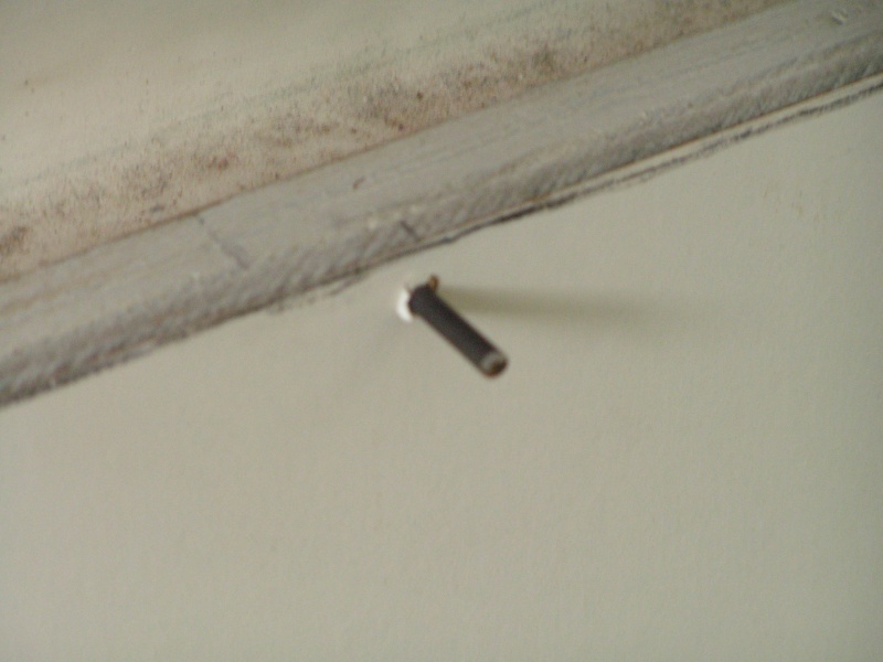Drywall screw inserted, then end cut off and rounded