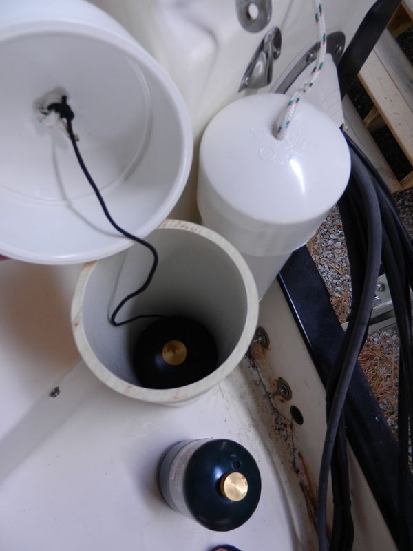 Each lid has a string attached to the second of the canisters to allow lifting it up from the bottom of the tube