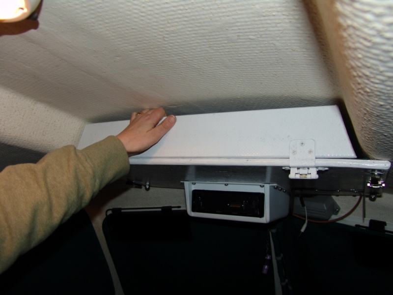 Easy to open and close. Bolts to roof using one bolt from top rail on each side and one additional bolt on each side.