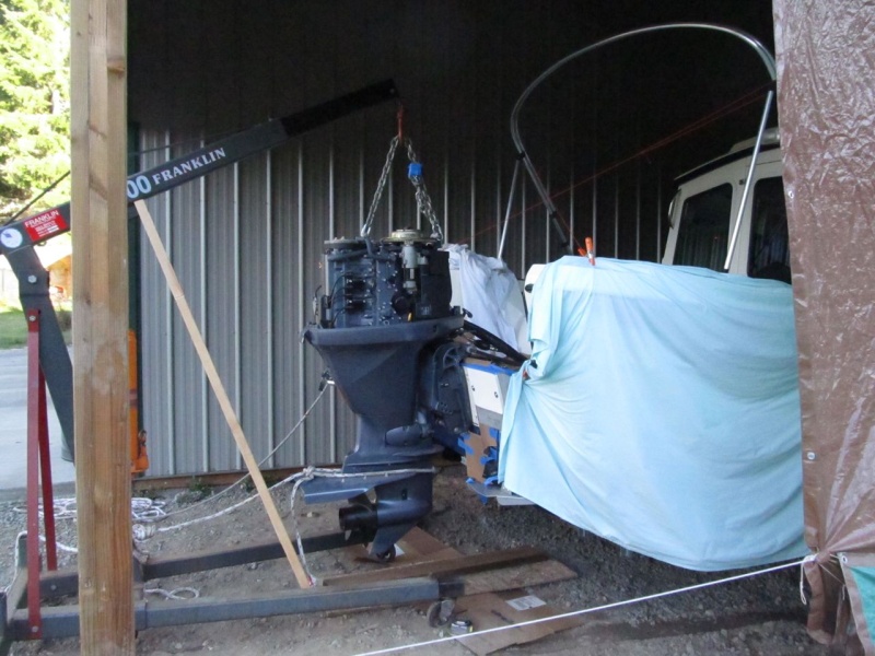 Engine hoisted up to do a multi-part project.  1) overdrill/epoxy fill/re-drill mounting holes; 2) Raise engine by two holes (1-1/2"); 3) Add wedges for 5? more tuck (probably); 4)Add aluminum "bar" across between upper mounts on inside of transom (like big washer); 5) Add larger washers on inside of lower holes; 6) Replace stainless coarse-thread fasteners with better grade coated, fine-thread fasteners; 7) Replace silicone (groan) with proper sealant.